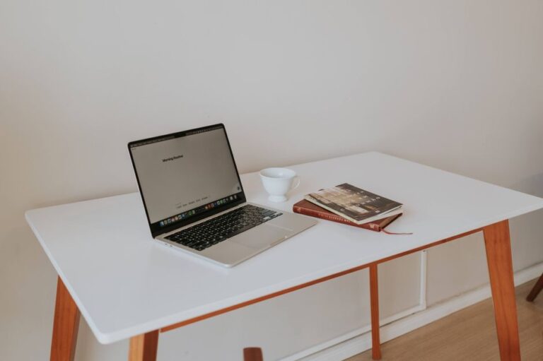 open laptop on white desk