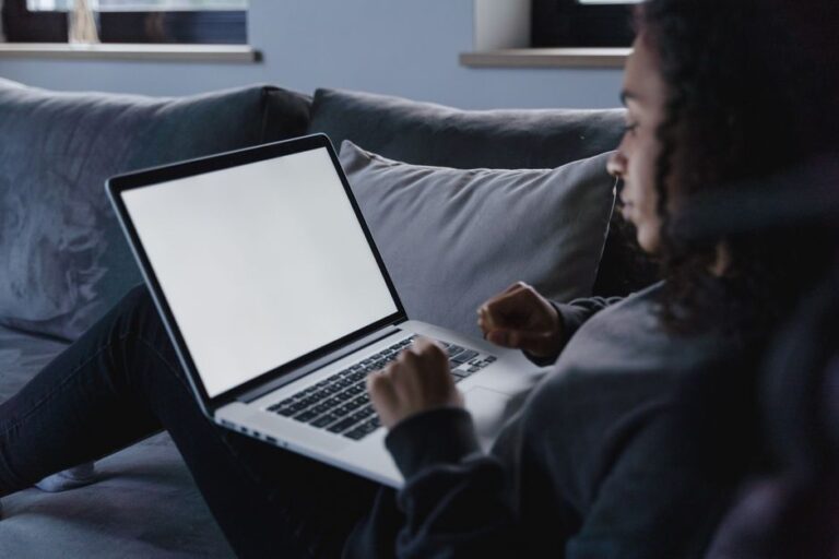 person using laptop in living room