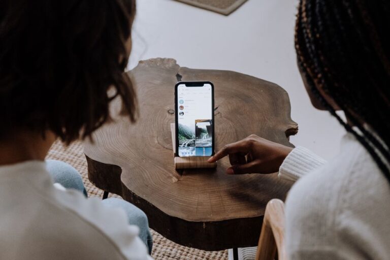 people using phones at table
