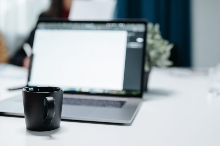 laptop and coffee on office desk