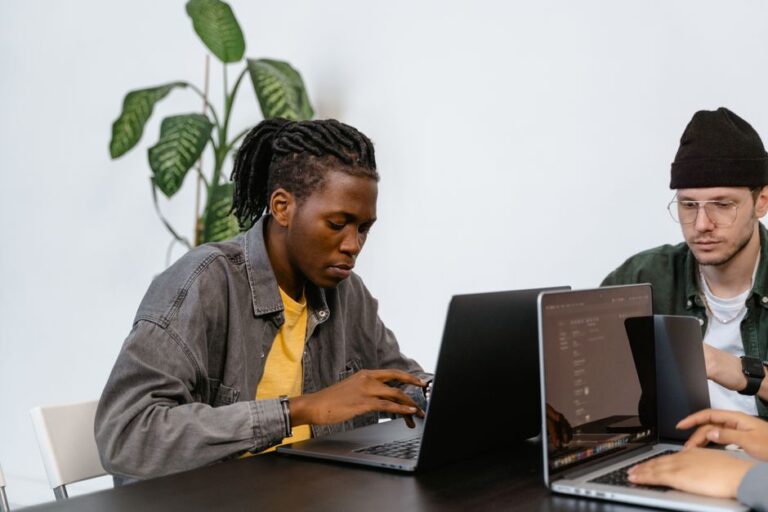 man on laptop in modern office
