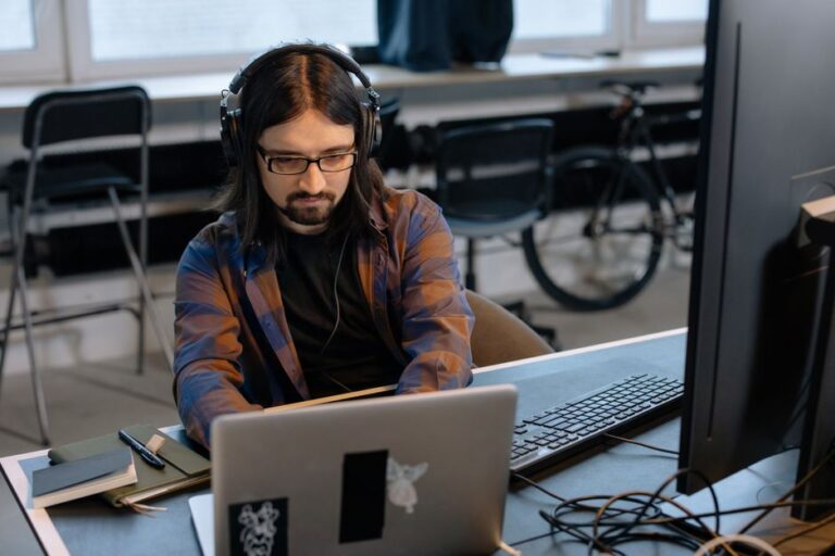 developer at desk with laptop