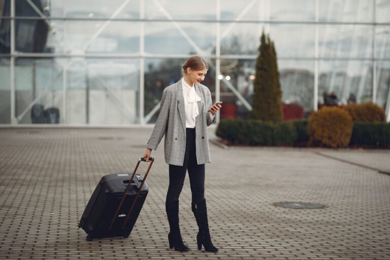 traveler using phone at airport